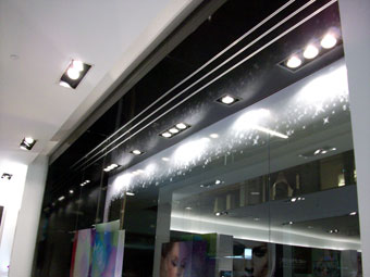 Black steel panels wrap the underside of the window display soffit.